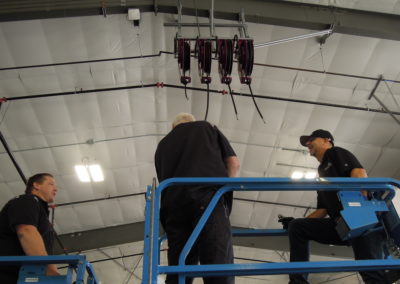 Photo of three Northwest Pump technicians on a scissor lift