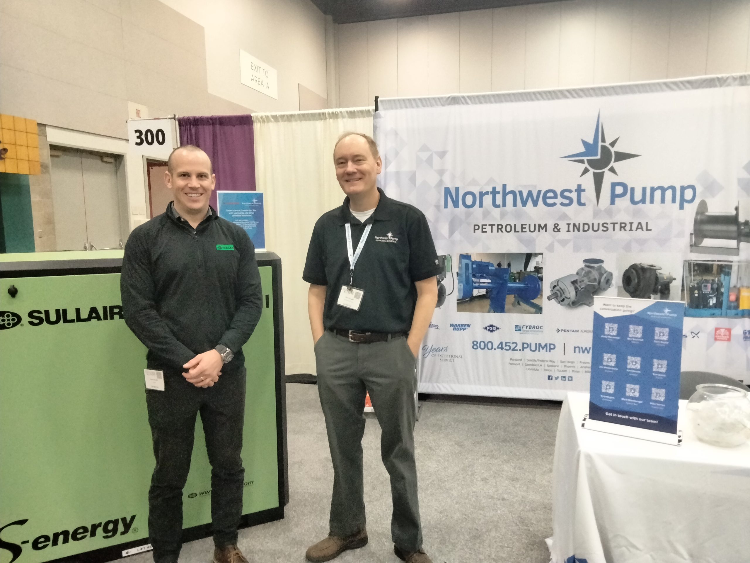 A Northwest Pump representative and a Sullair representative at a convention