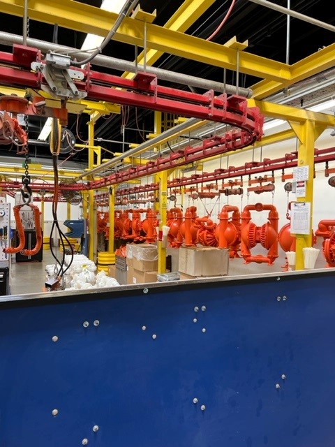 Photo of industrial pumps on an assembly line