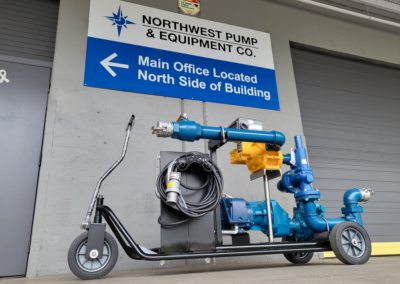 Industrial pump bike under the Northwest Pump sign