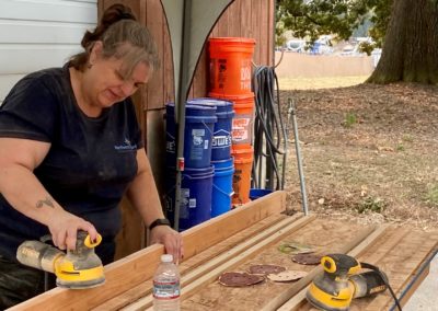 Photo of a woman using a disc sander