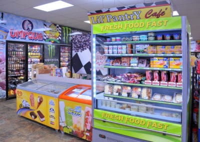 Photo of convenience store ice cream coolers and cold food